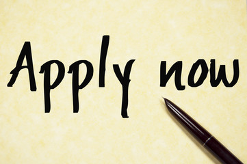 apply now text write on paper