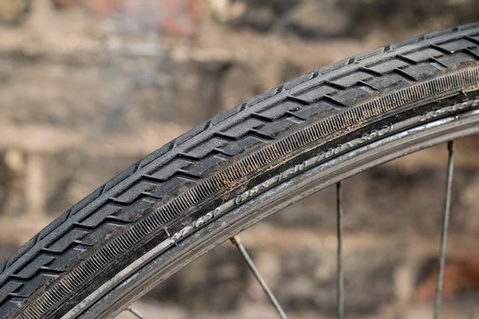 Bicycle Tire With Brick Wall Background