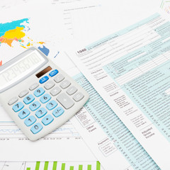 US 1040 Tax Form and calculator - studio shot