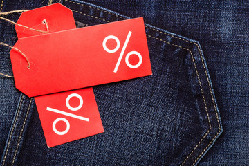 red label with percent sign on denim
