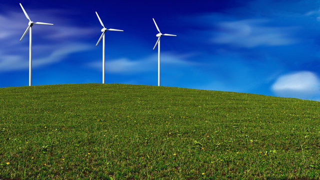 wind generators on meadow - renewable energy concept