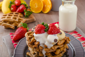 Belgian waffles with chocolate chips and fruits