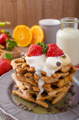 Belgian waffles with chocolate chips and fruits