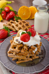 Belgian waffles with chocolate chips and fruits
