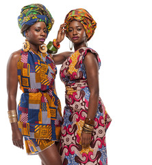 African female models posing in dresses.