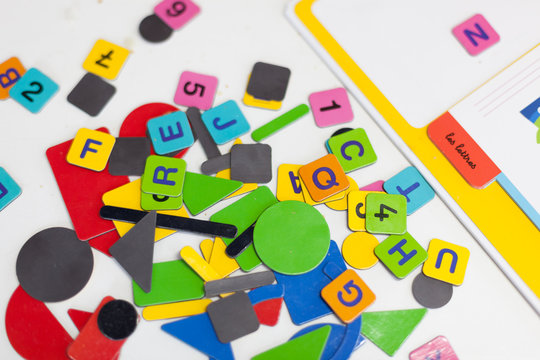 Close up of multi-coloured alphabet puzzle pieces