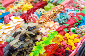 Colorful jelly candies for sale at market stall, La Boqueria