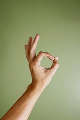 Hand making an ok sign