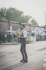 handsome big moustache hipster man playing mandolin