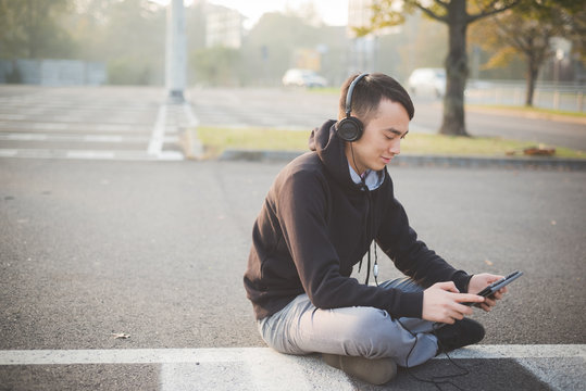 Young Crazy Funny Asian Man In Town Outdoor Lifestyle Listening