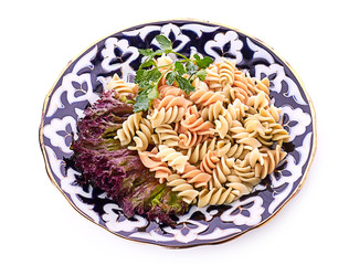 Penne pasta with sauce, cheese and basil, selective focus