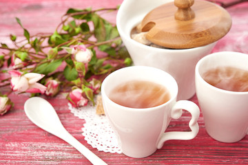 tea with sugar cubes on wooden