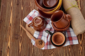 plates and cups on wooden table