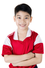 Portrait of Happy asian cute boy in red sport uniform