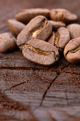 Coffee beans on wood background