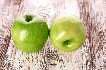 green apple on wooden background