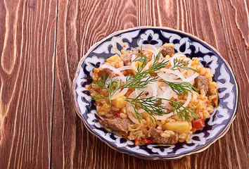 Oriental shah pilaf, pilaw, plov, rice with meat in pastry filo