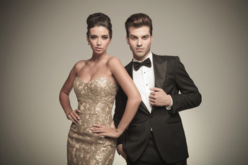 Attractive elegant man fixing his jacket