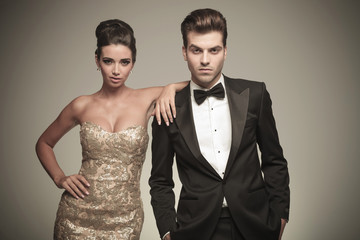 Beautiful elegant woman leaning on her lover