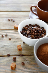 coffee beans in a bowl and cup