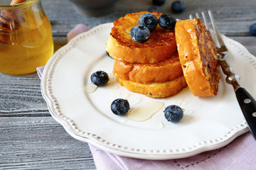 French toast with blueberries on a plate