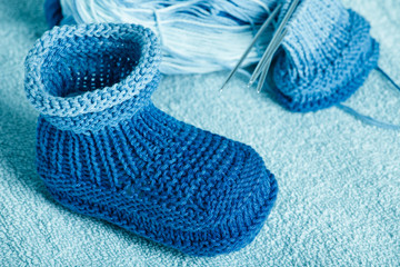 ball of blue-blue melange threads for knitting of bootees to the