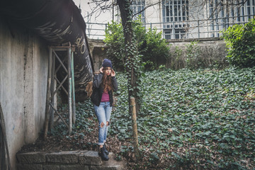 Beautiful girl posing in an urban context