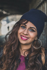 Beautiful girl posing in an urban context