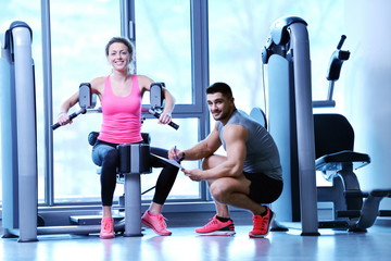 woman exercising with her personal trainer
