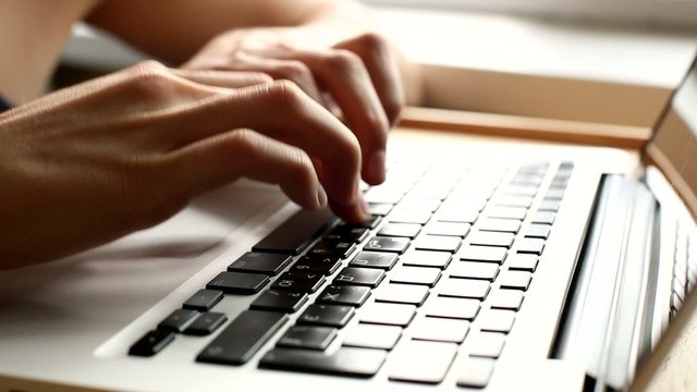 Women's hands typing on computer keyboard (HD)