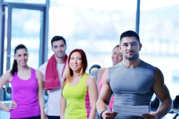 Group of people exercising at the gym