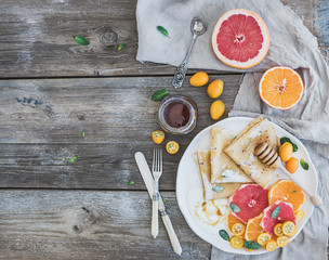 Spring vitamin breakfast set. Thin crepes or pancakes