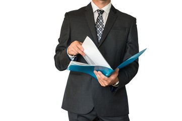 Man in suit looking at documents