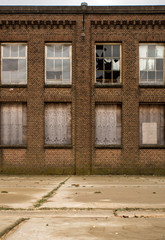 Fototapeta na wymiar brick facade of an old abandoned factory
