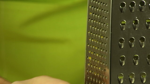 Hands grate orange zest