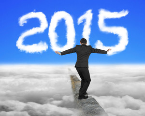 Businessman balancing on concrete ridge with white 2015 shape cl