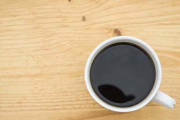 cup of coffee on wooden table