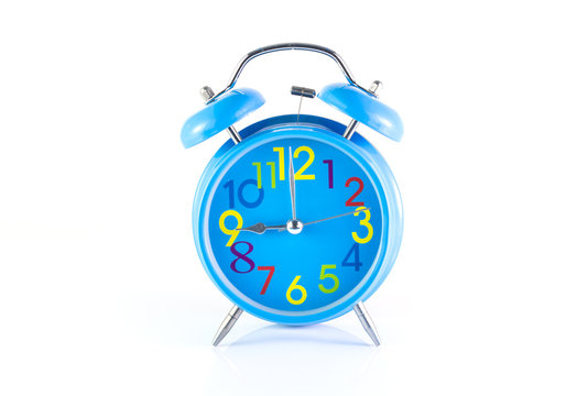 Alarm Clock isolated on white, in blue, showing nine o'clock.