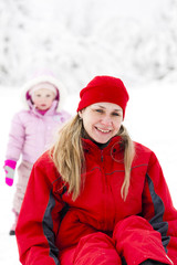 Fototapeta premium portrait of mother with little daughter in winter