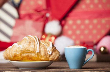 Cup of coffee and croissant