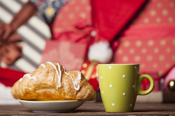 Cup of coffee and croissant
