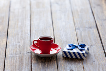 Cup of coffee and gift box