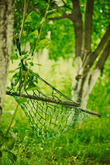 Empty hammock strung between two trees