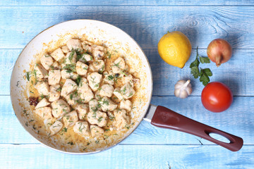 cooked fried braised chicken breast in a pan