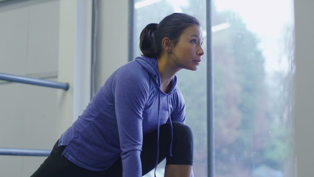 Young woman stretching before a workout in slow motion