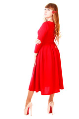 Young woman in a bright red evening dress