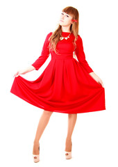 Young woman in a bright red evening dress