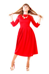Young woman in a bright red evening dress