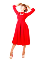 Young woman in a bright red evening dress