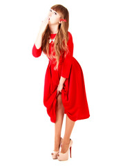 Young woman in a bright red evening dress